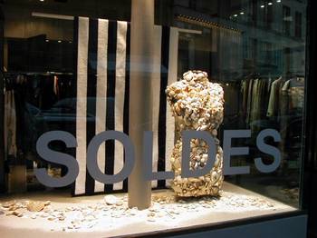Shop window on rue de four; sea shells on mannequin